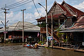 Thailand, Locals sell fruits, food and products at Damnoen Saduak floating market near Bangkok 